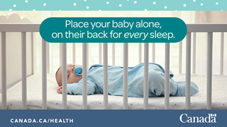 Photo of a baby sleeping on their back alone in their crib.