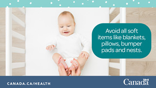 Photo of a baby on their back alone in their crib.