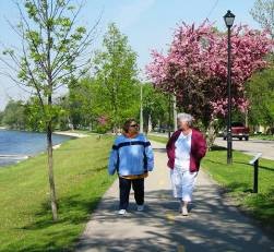 Two people walking in the city of Portage la Prairie	