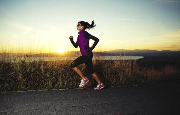 Image of a woman running. The image promotes leading active lifestyle.
