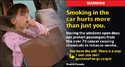 A little girl coughing inside a vehicle because of tobacco smoke.